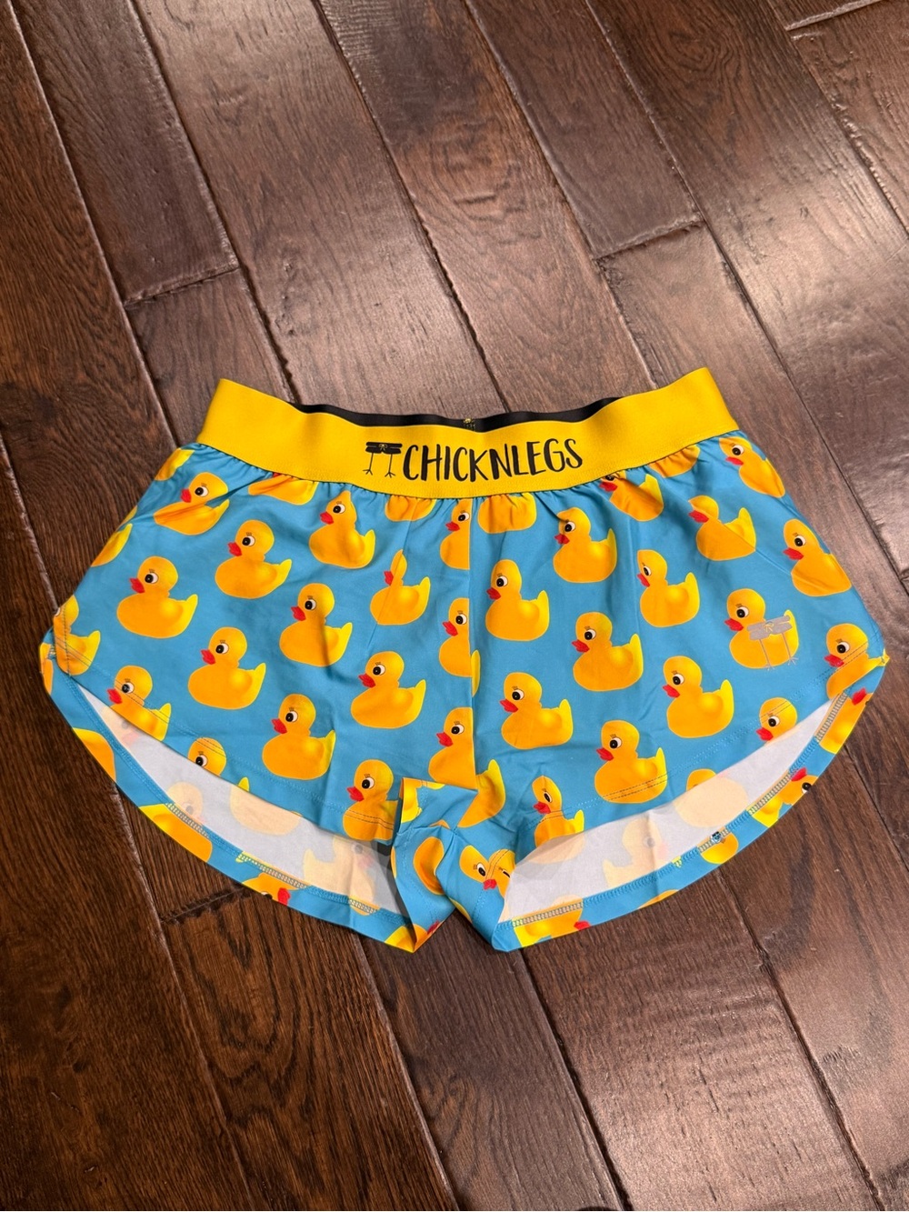 Chicknlegs Women's Blue Duck Print Athletic Shorts with Yellow Waistband